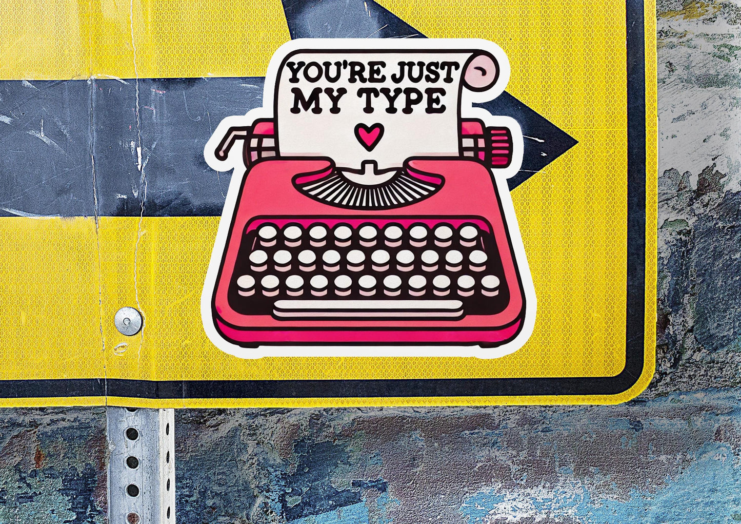 a street sign with a typewriter on it