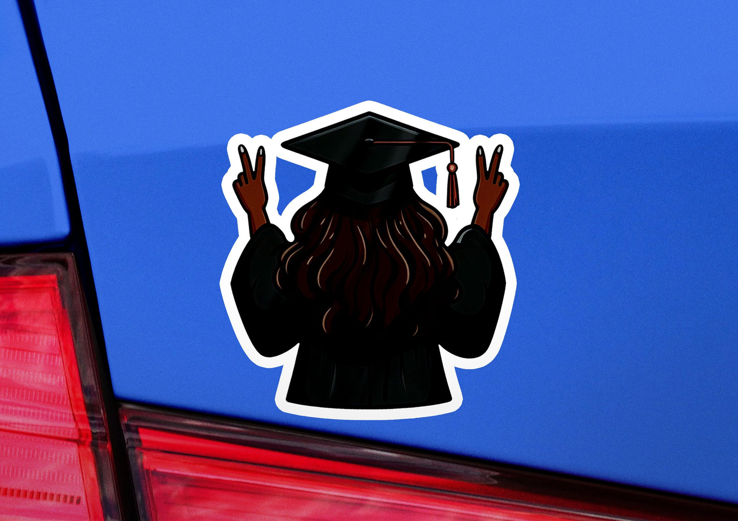 a sticker of a person wearing a graduation cap and gown