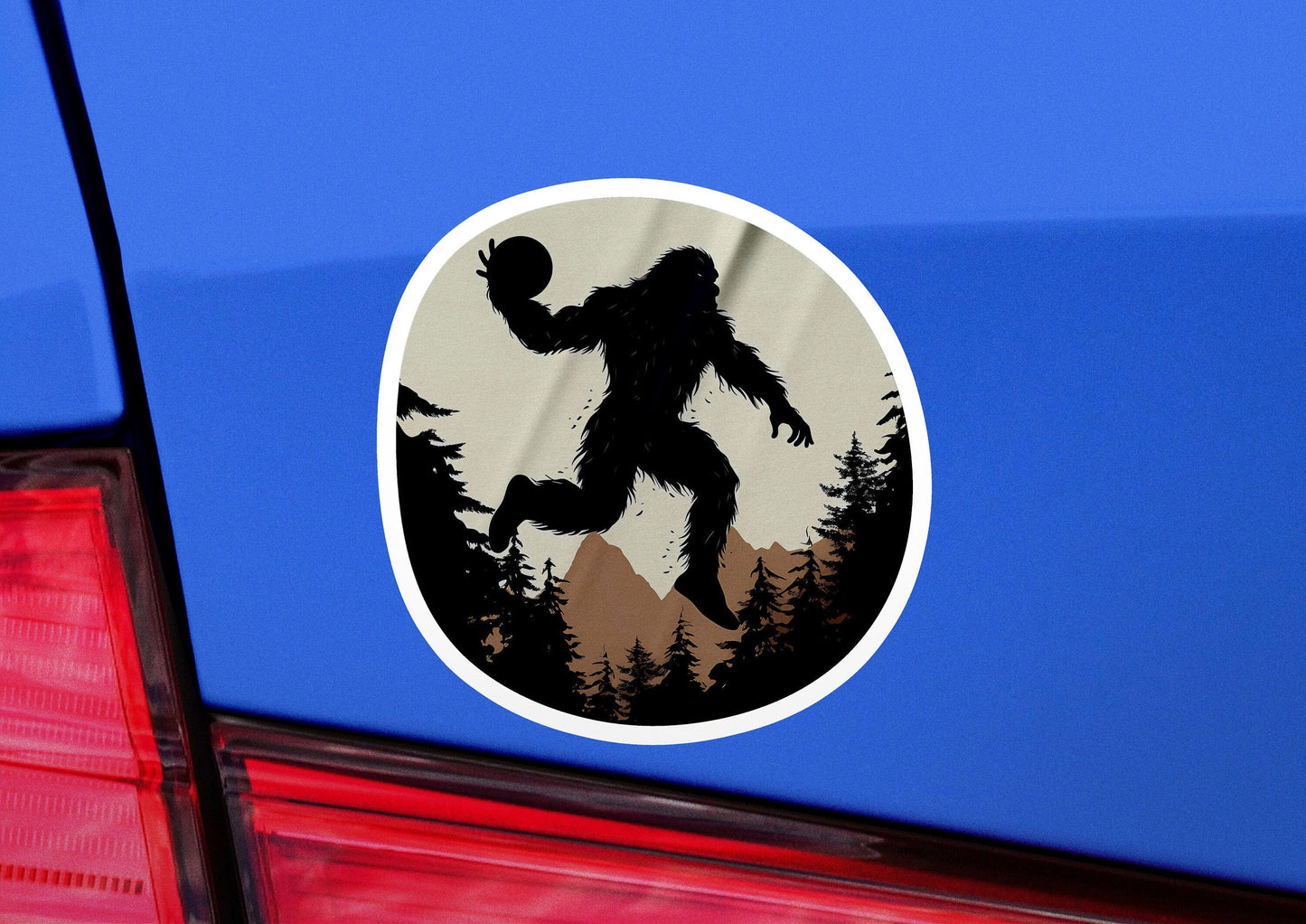 a bigfoot sticker on the back of a car