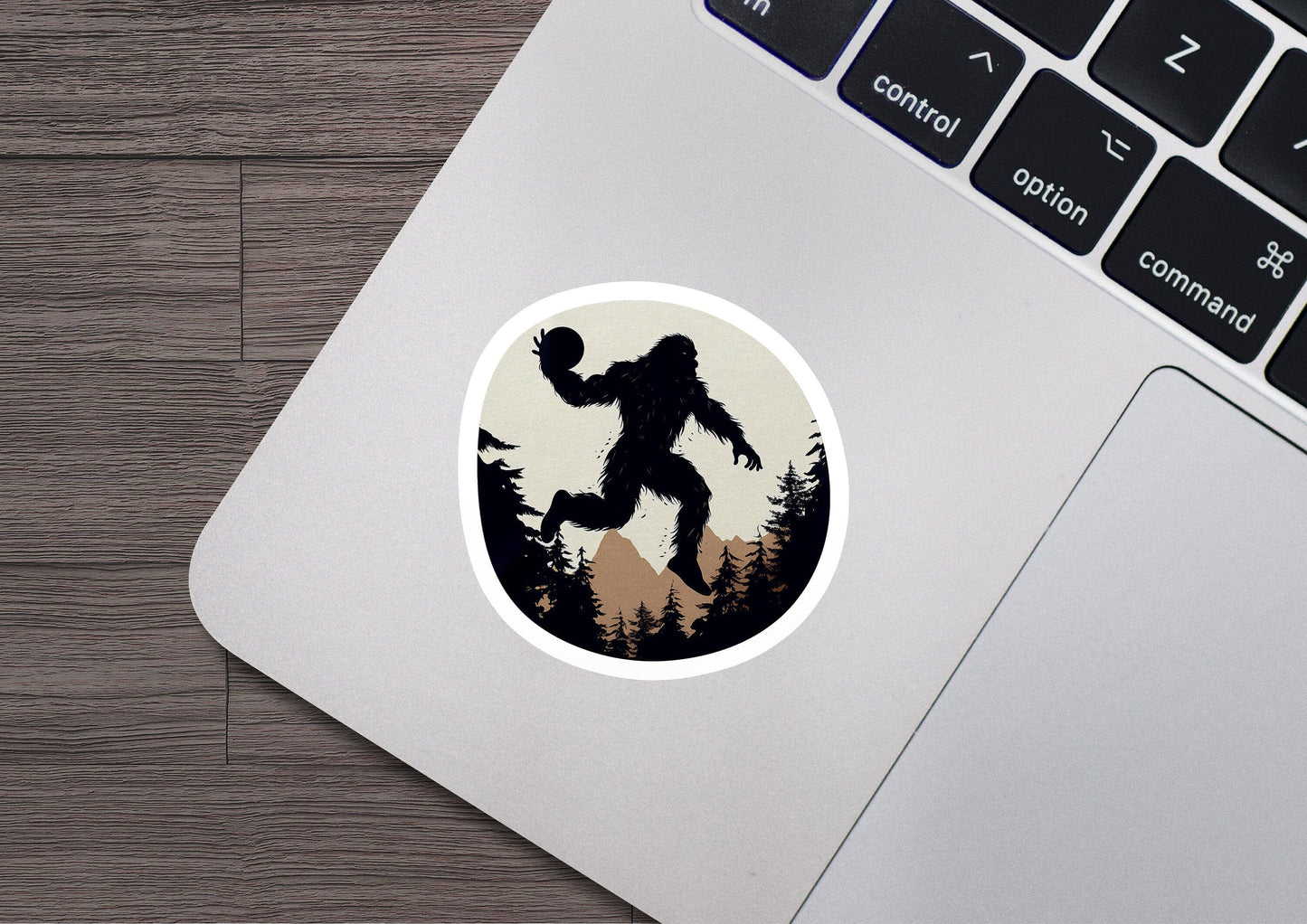 a bigfoot sticker on a laptop computer