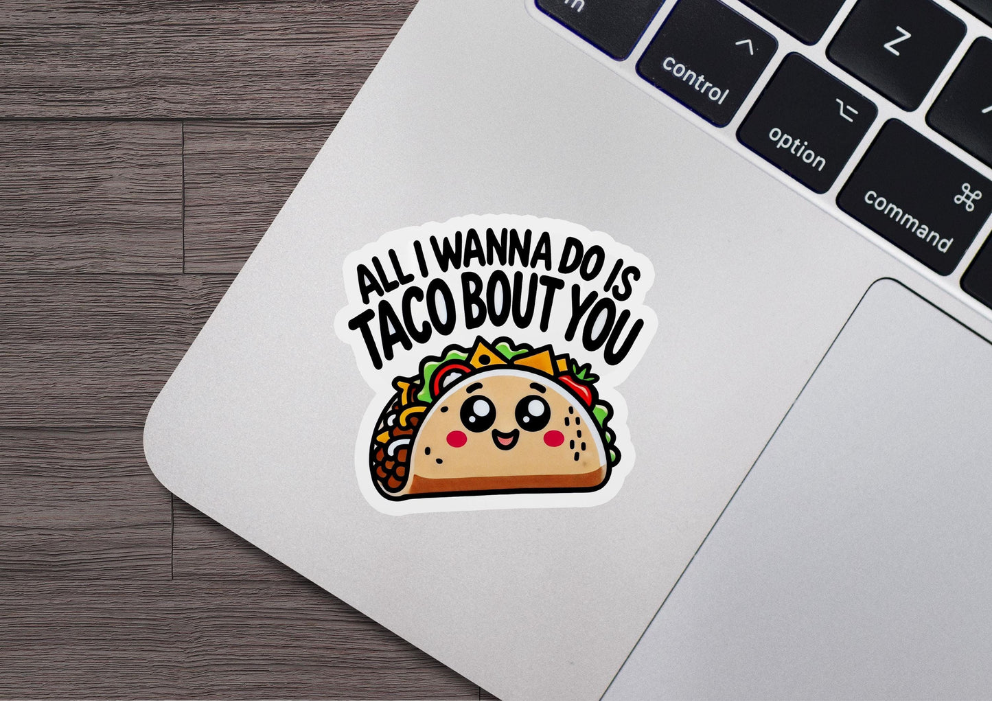 a laptop with a sticker of a taco on it