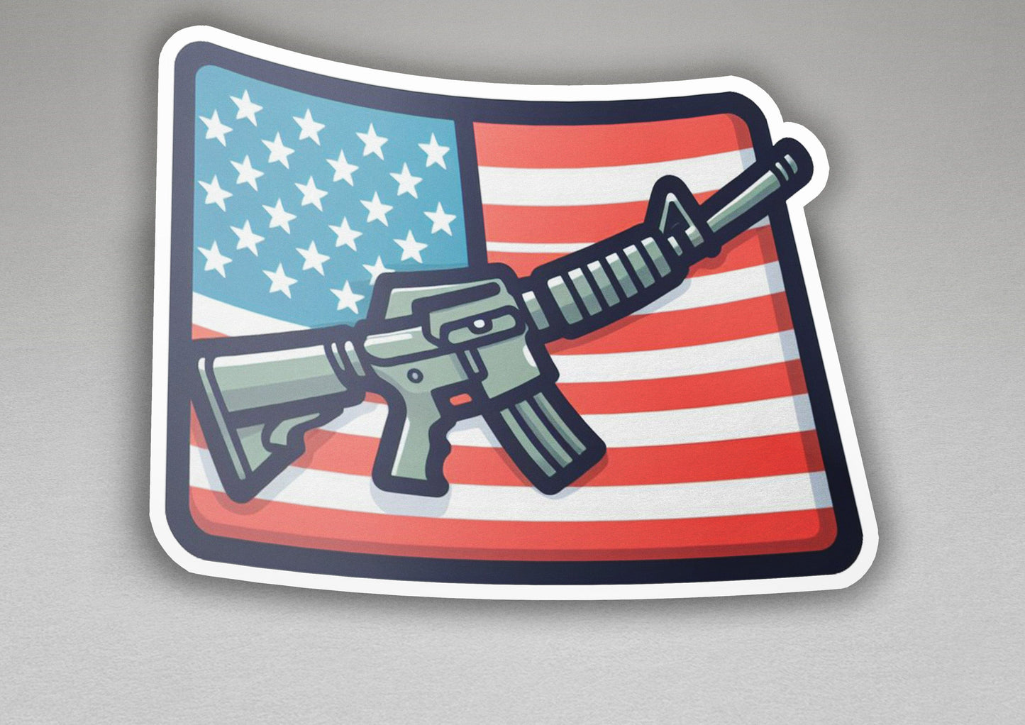 a sticker of a gun with the american flag