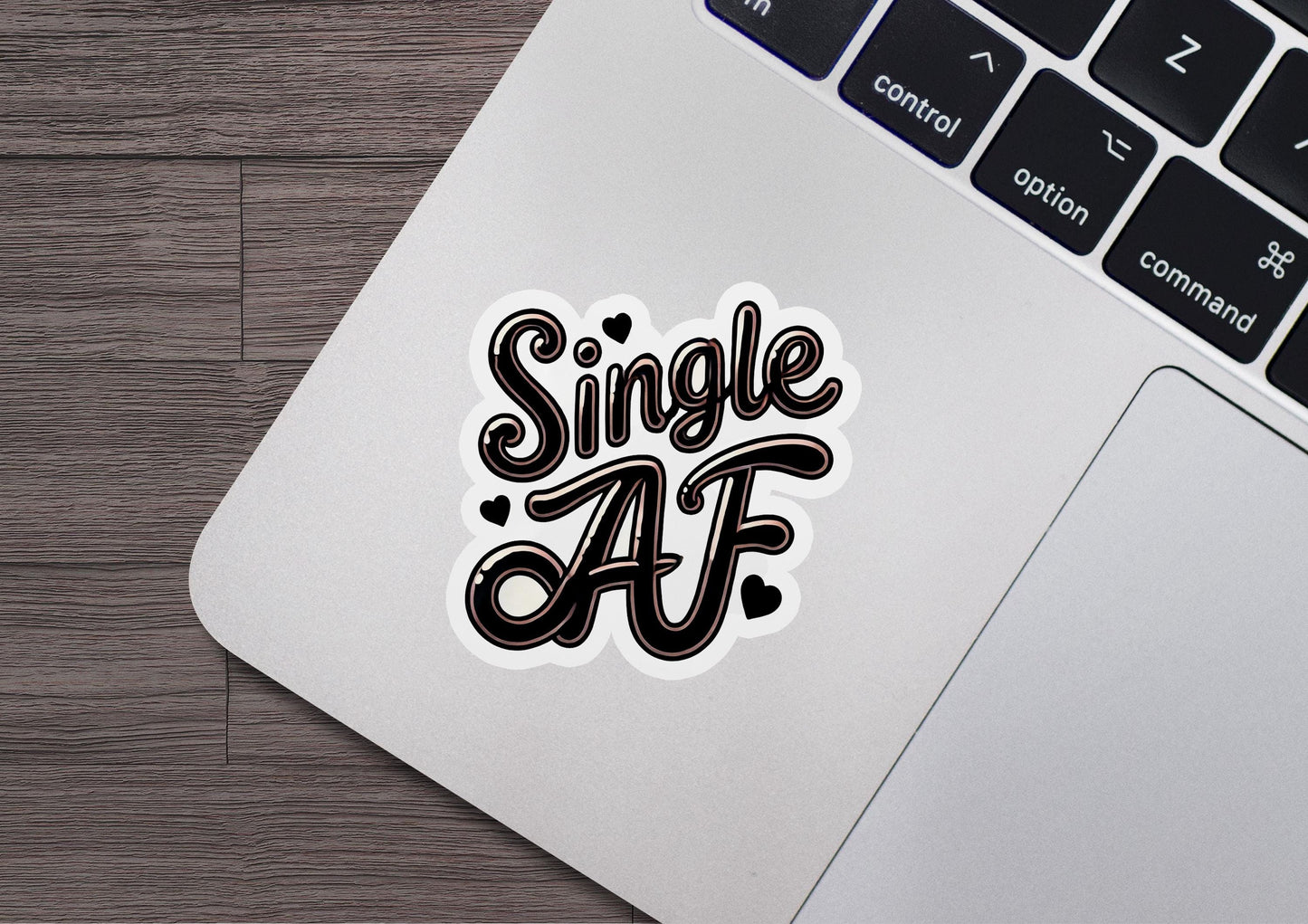 a sticker that says single af on a laptop