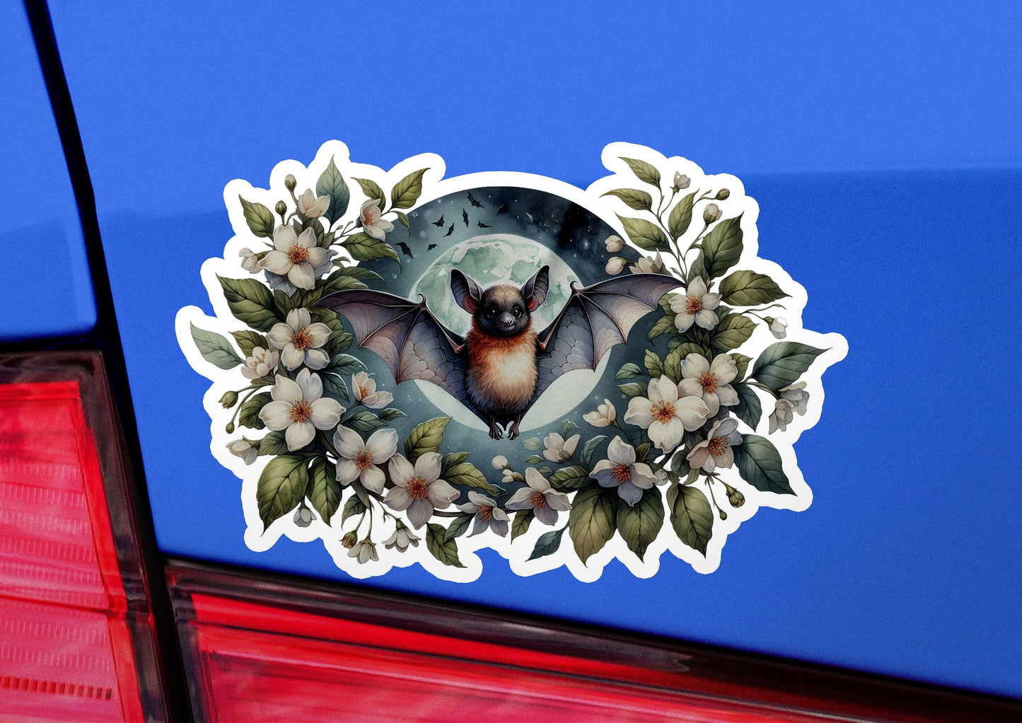a sticker of a bat with flowers on it