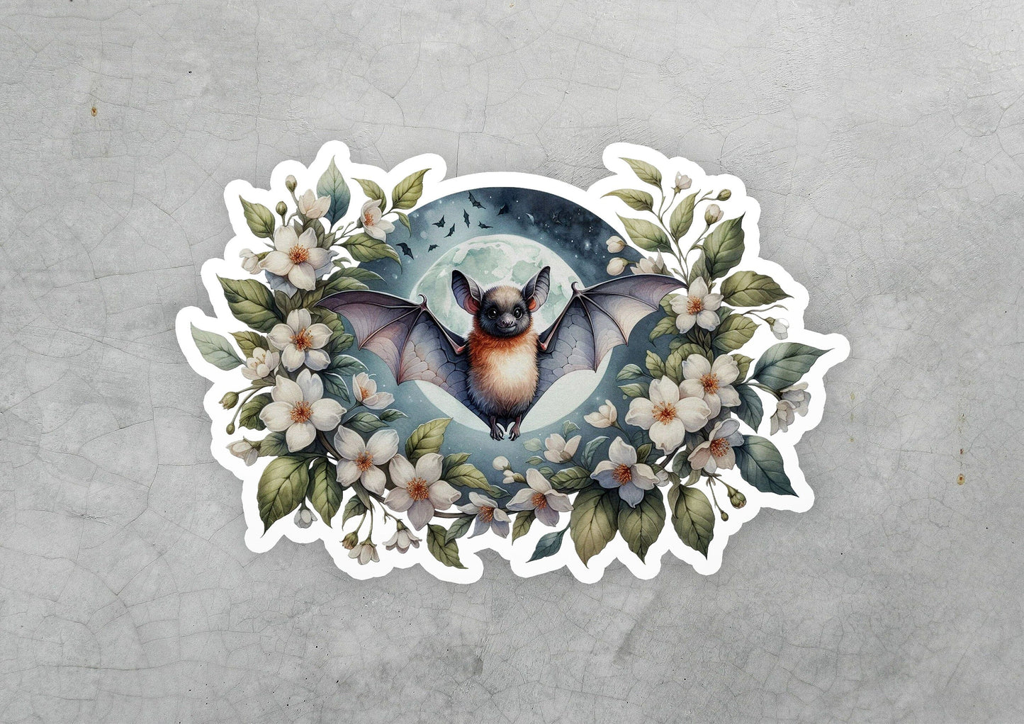 a sticker of a bat with flowers around it