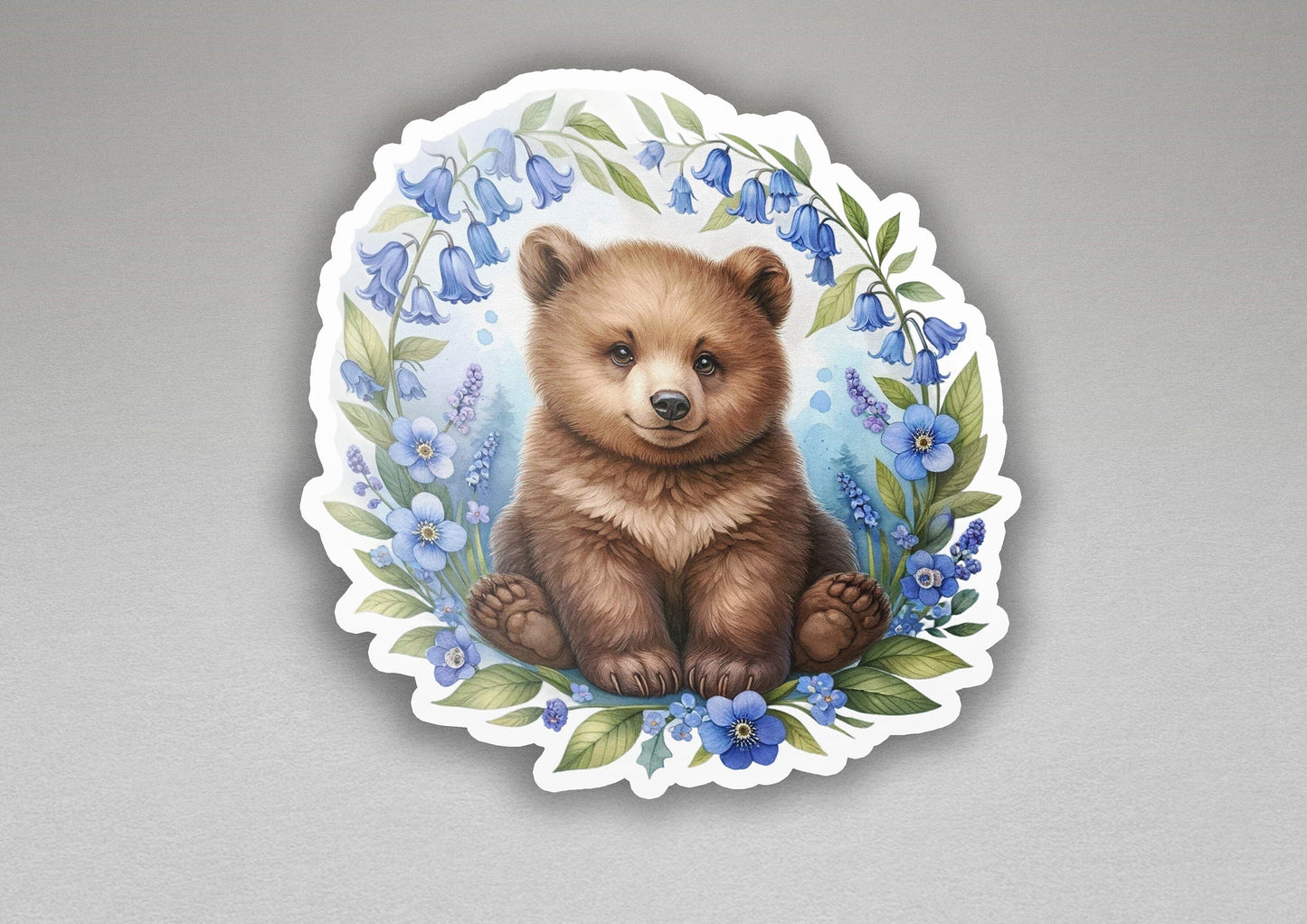a picture of a brown bear with blue flowers