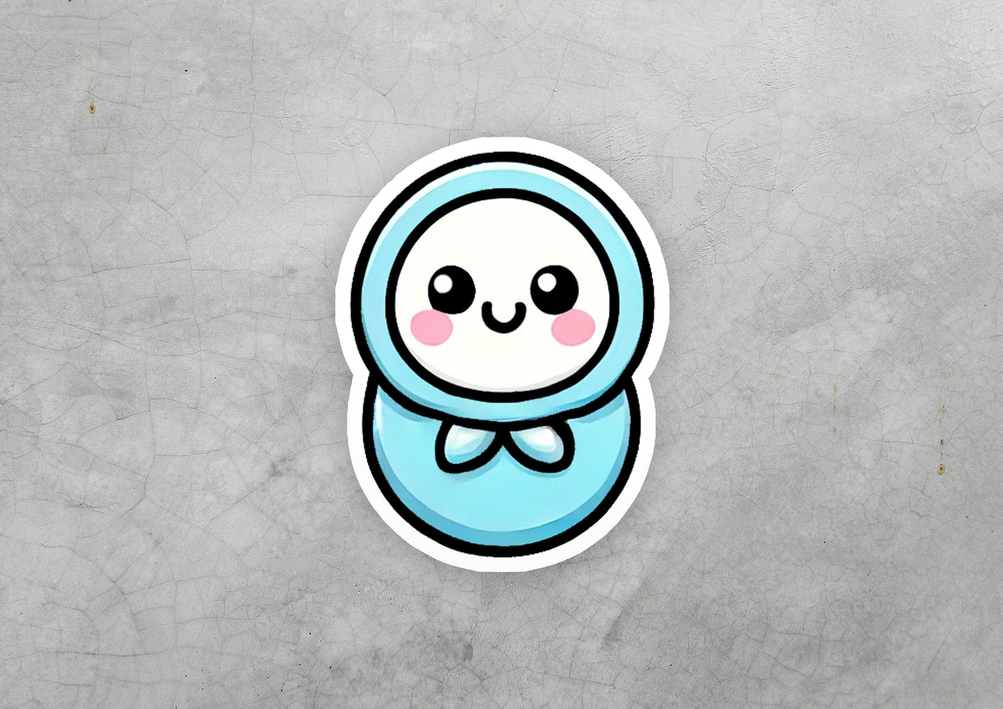 a blue sticker with a cute face on it
