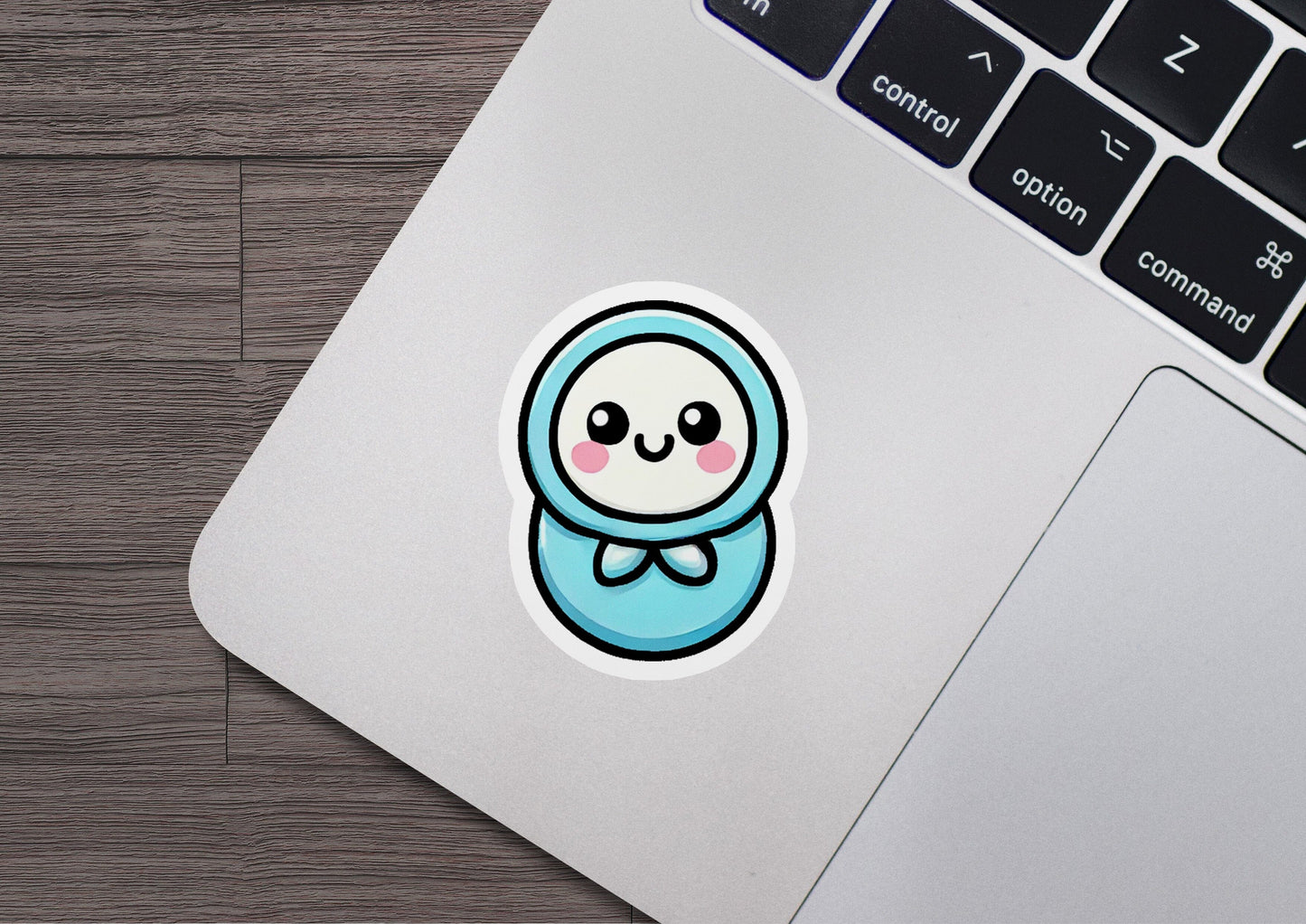 a laptop with a sticker of a cartoon character
