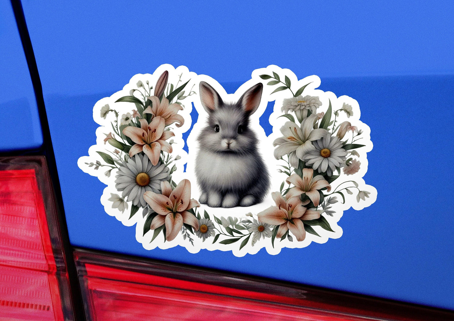 a sticker of a rabbit sitting in a wreath of flowers