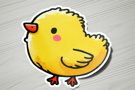 a sticker of a yellow chicken on a table