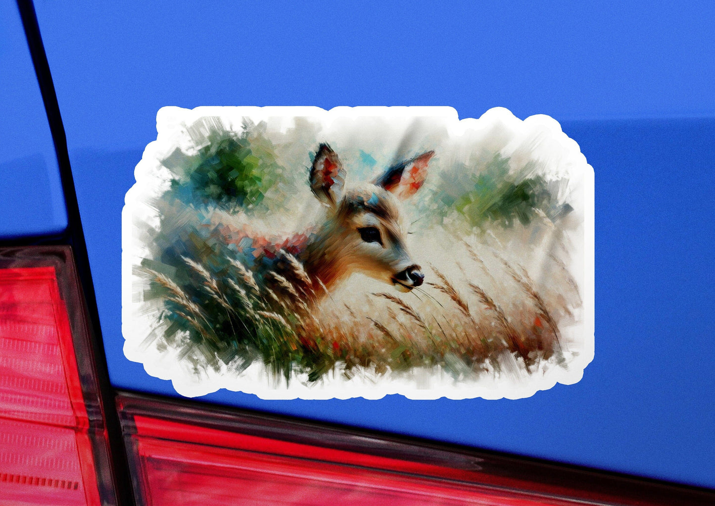 a deer sticker on the back of a car