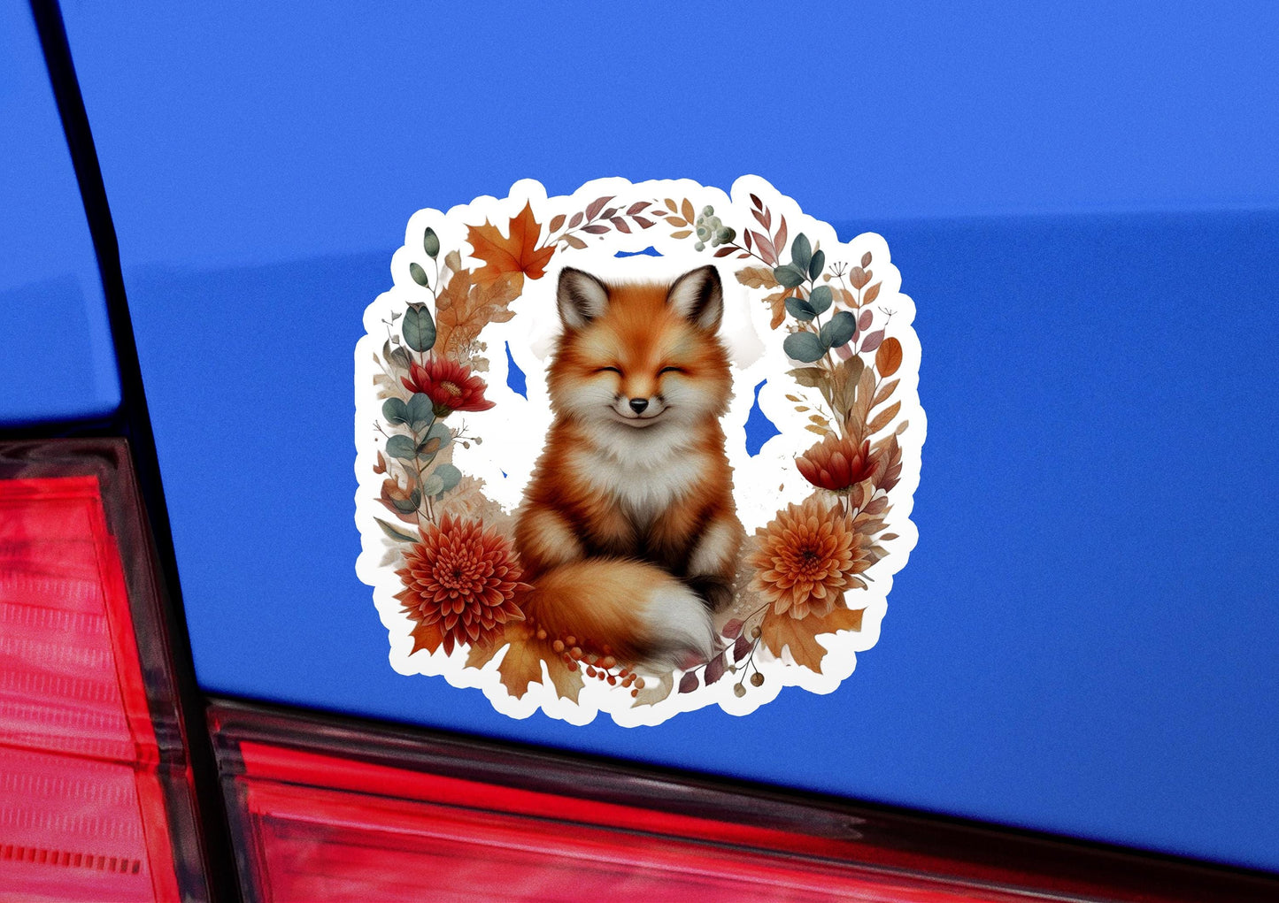 a sticker of a fox sitting on the tail of a car