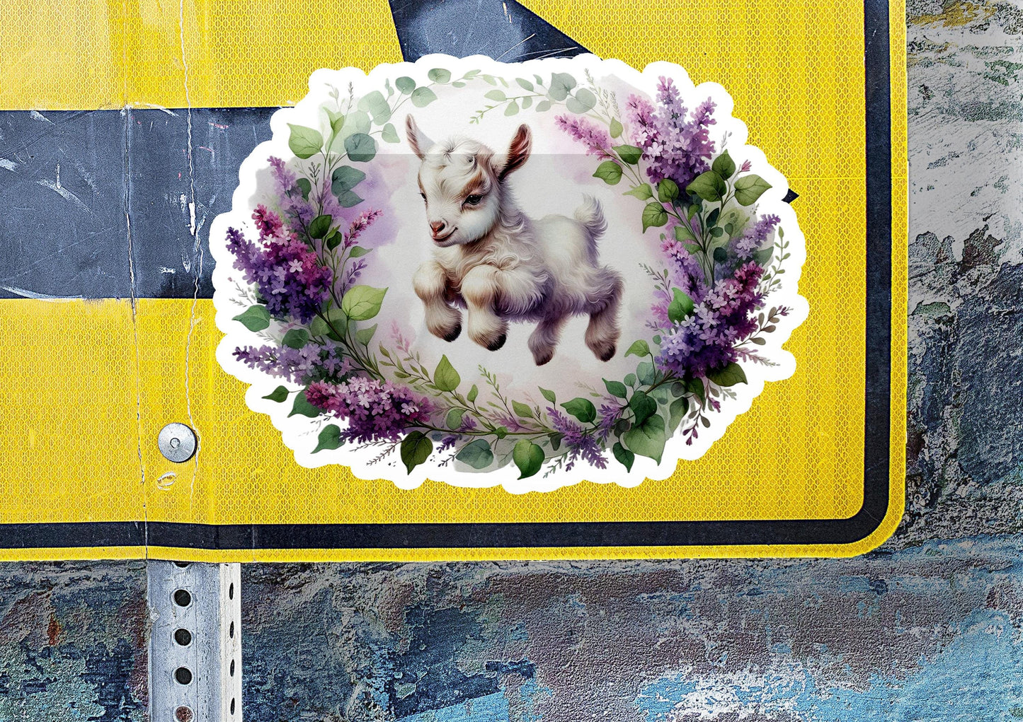 a sticker with a picture of a baby goat on it