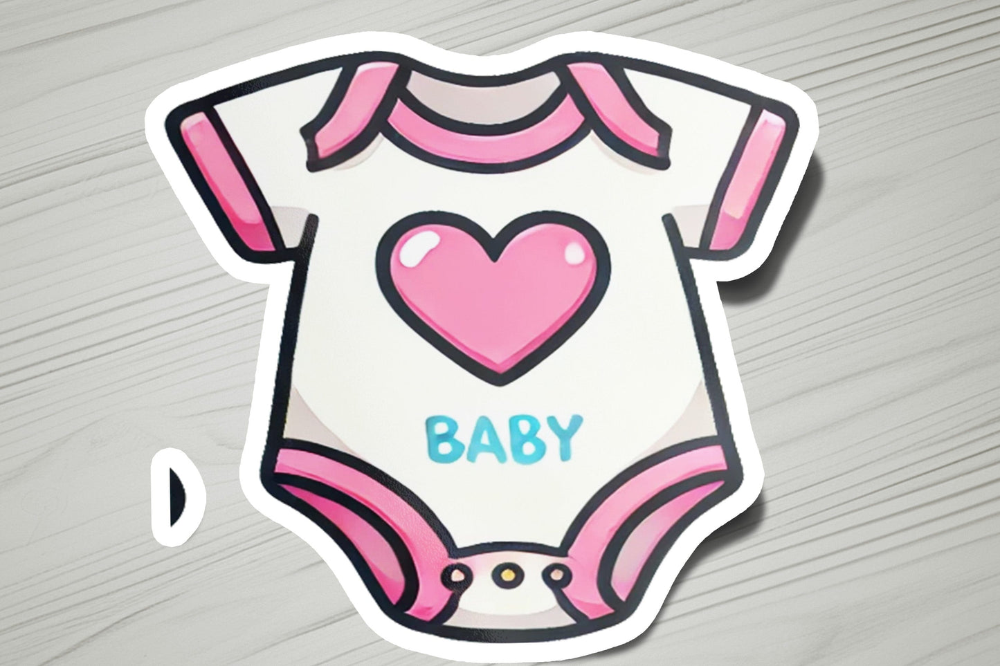 a baby onesuit with a heart on it