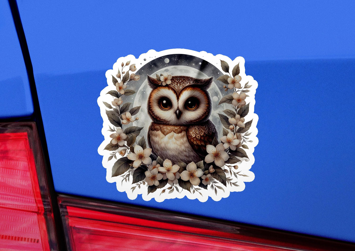 an owl sticker on the back of a car
