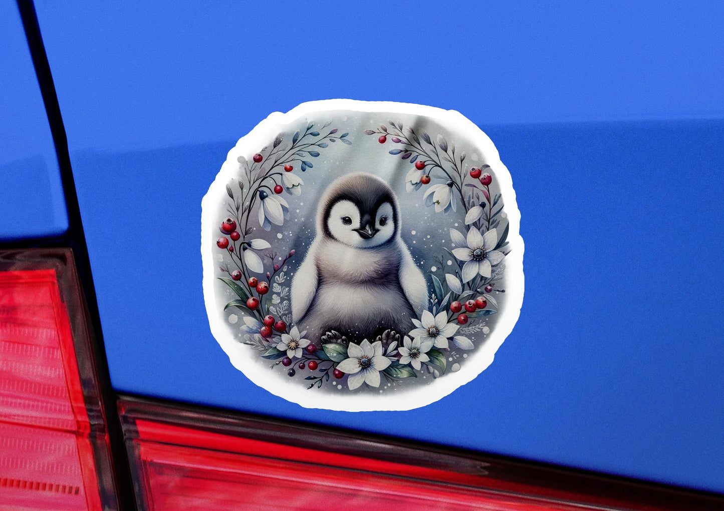 a sticker of a penguin with a wreath of flowers