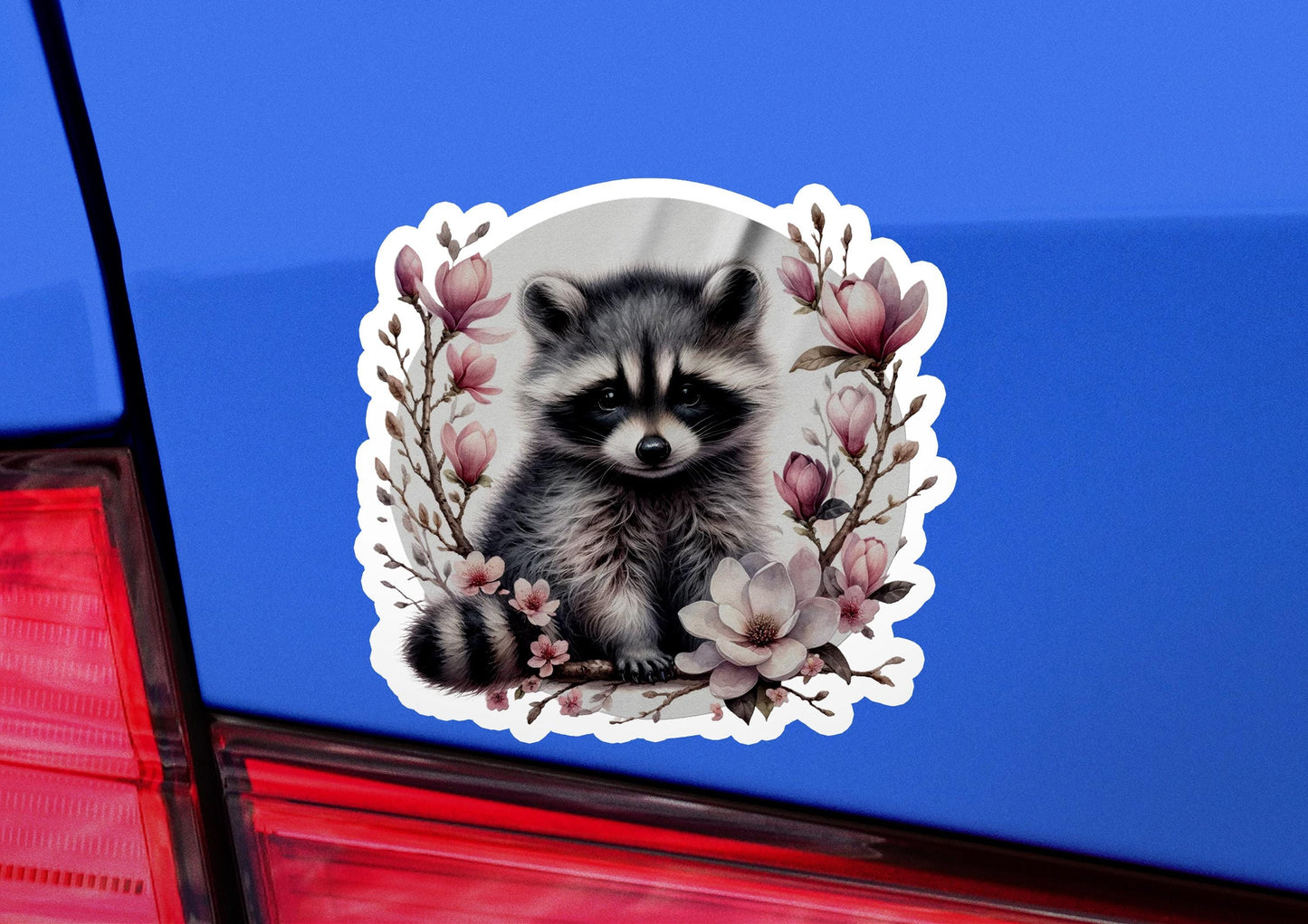 a sticker of a raccoon sitting on the back of a car