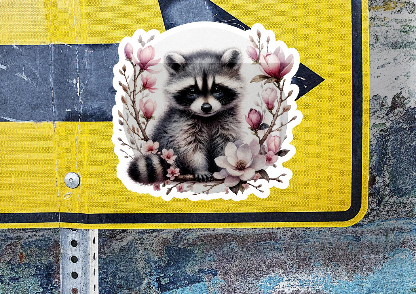 a sticker of a raccoon sitting on a street sign