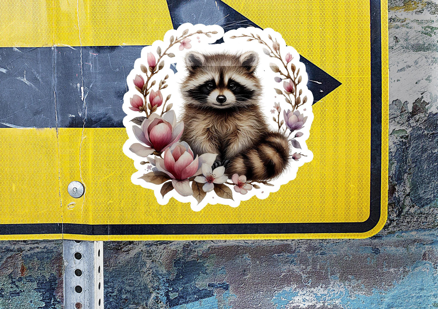 a sticker of a raccoon on a street sign