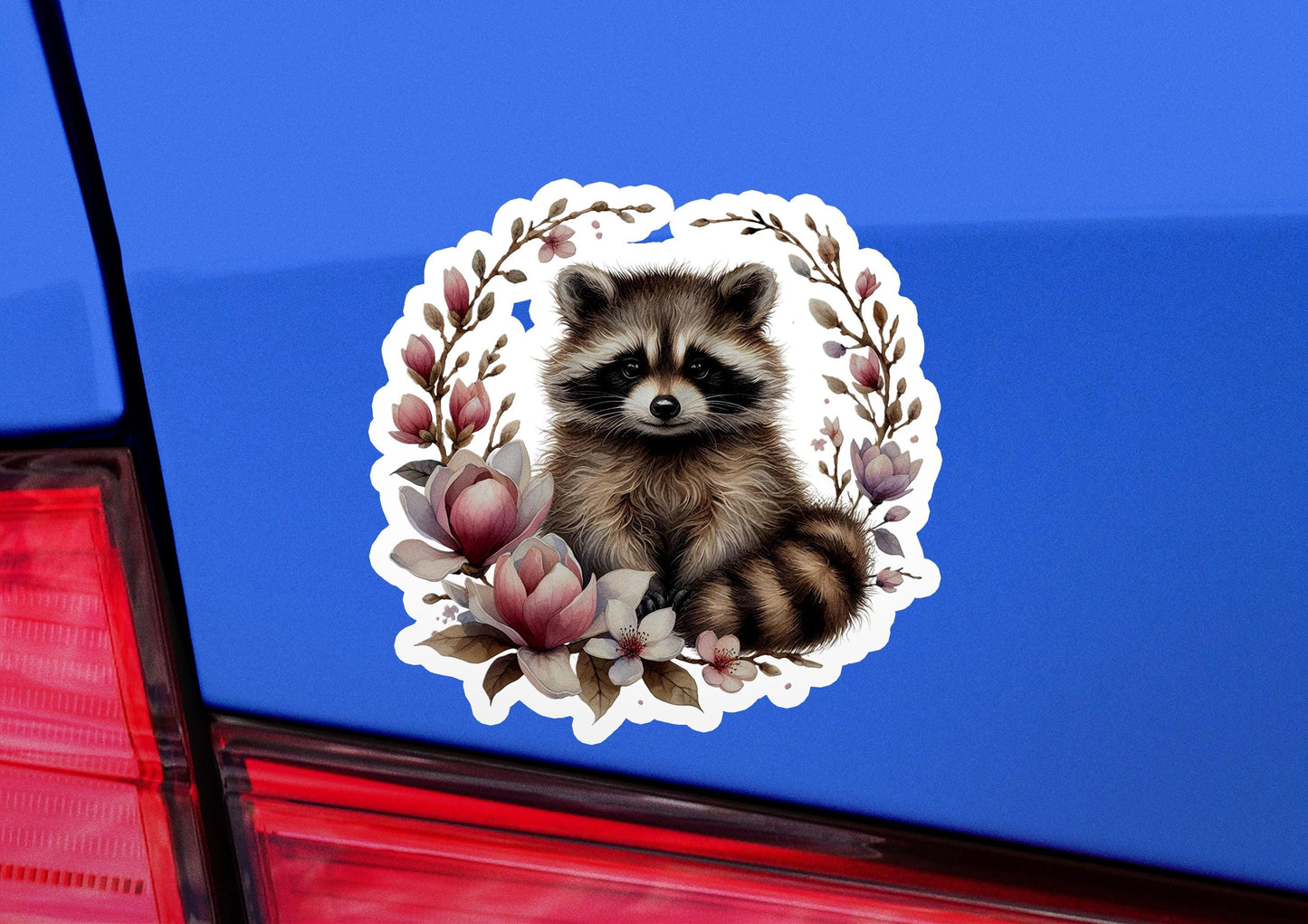 a sticker of a raccoon sitting on the back of a car