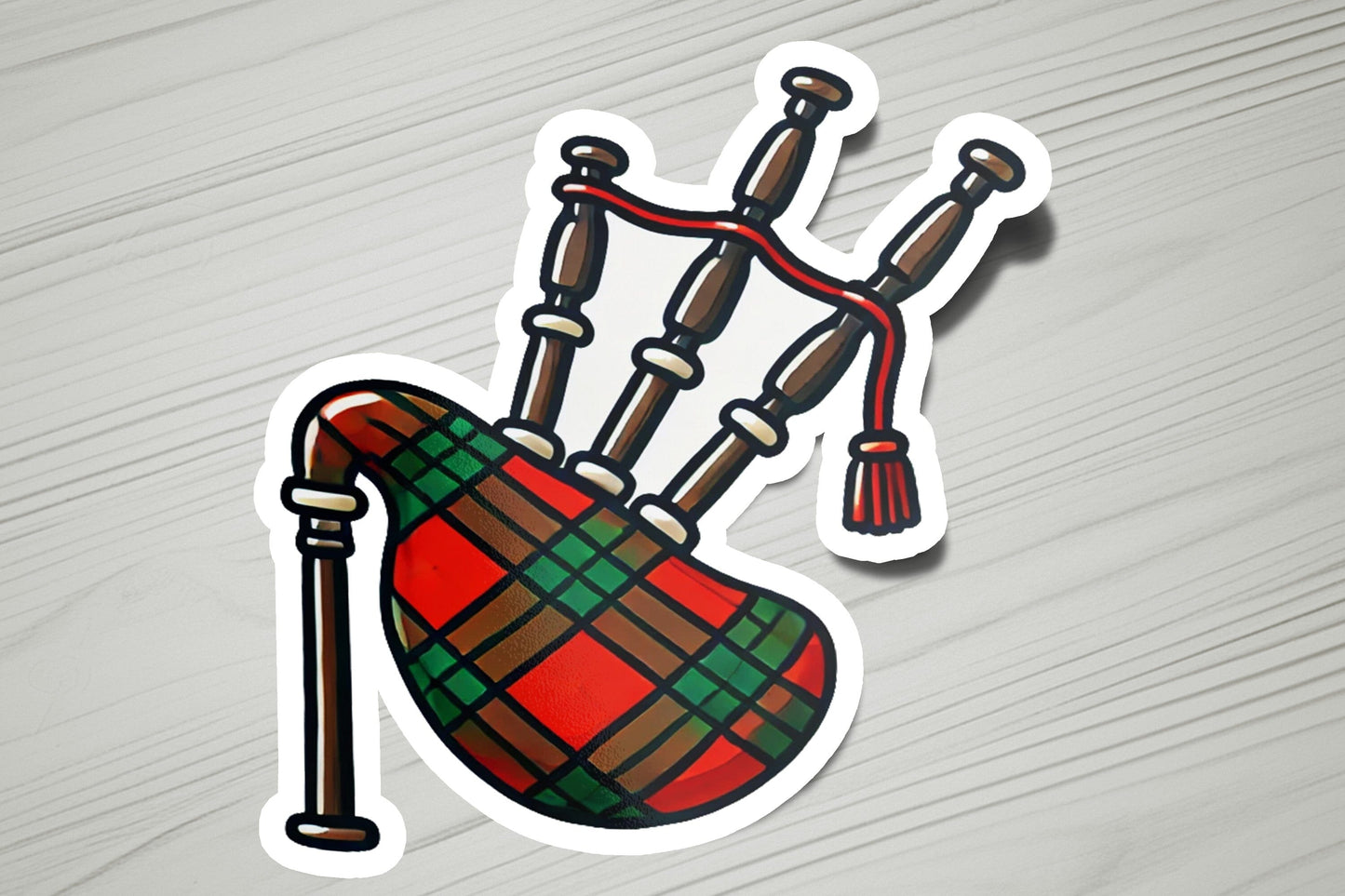 a sticker of a bag with a tassel on it