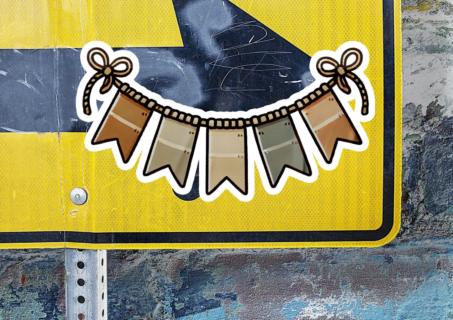 a yellow street sign with some stickers on it