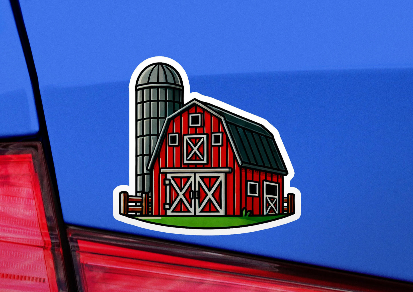 a sticker of a barn and a silo on a car