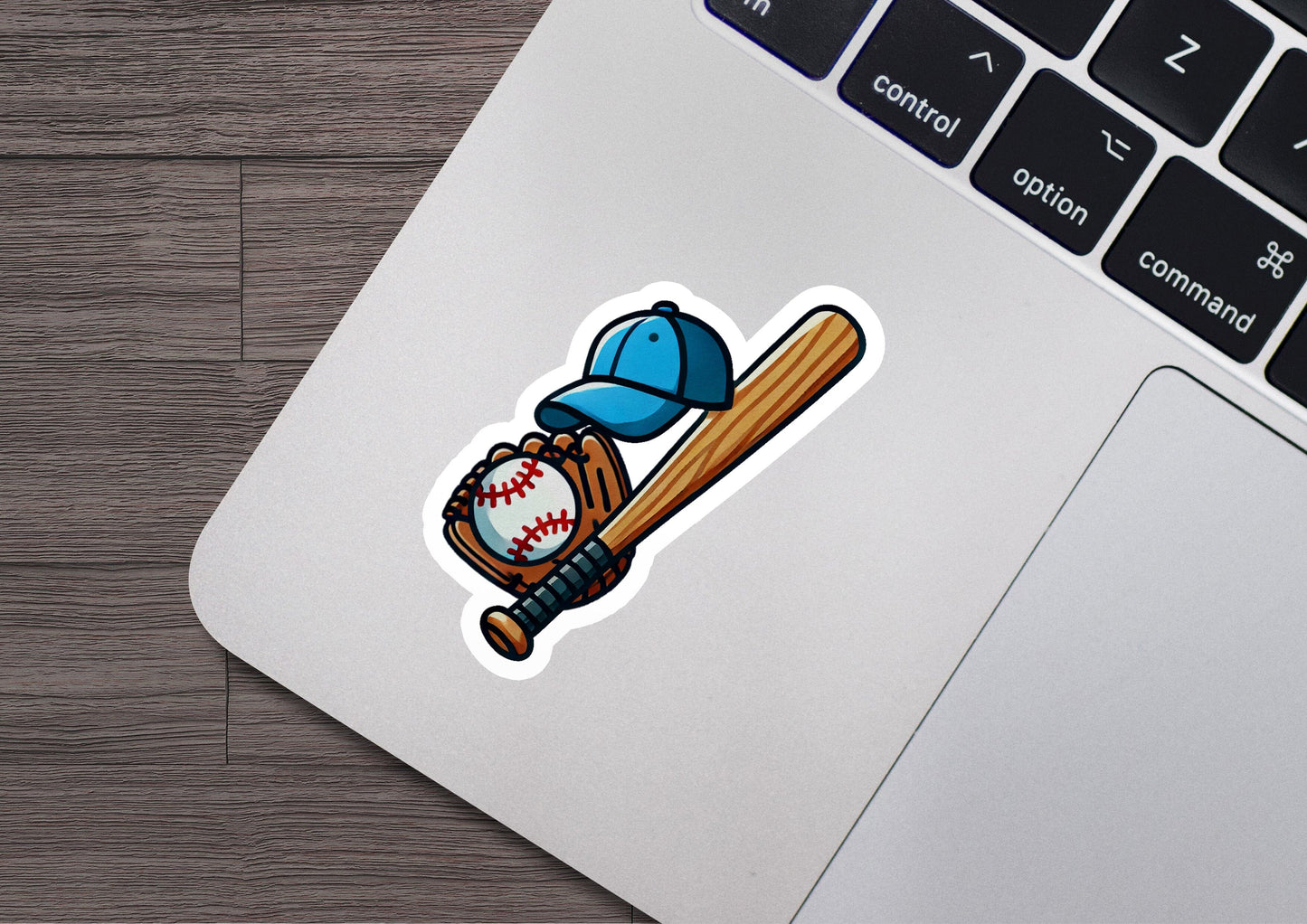 a laptop with a sticker of a baseball bat and ball