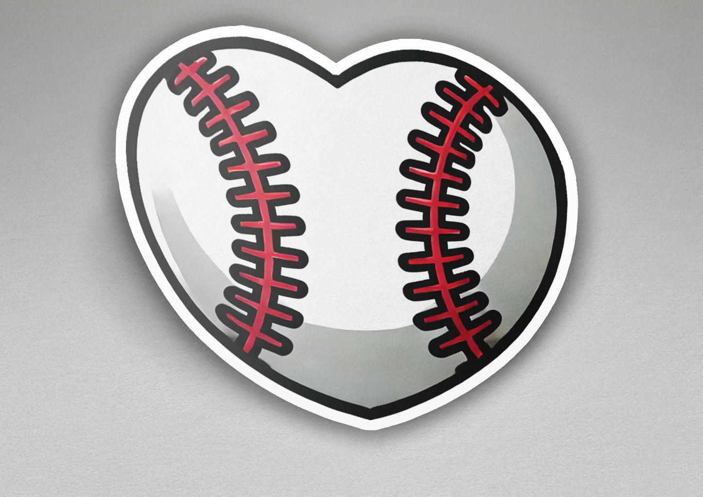 a heart shaped sticker with a baseball on it