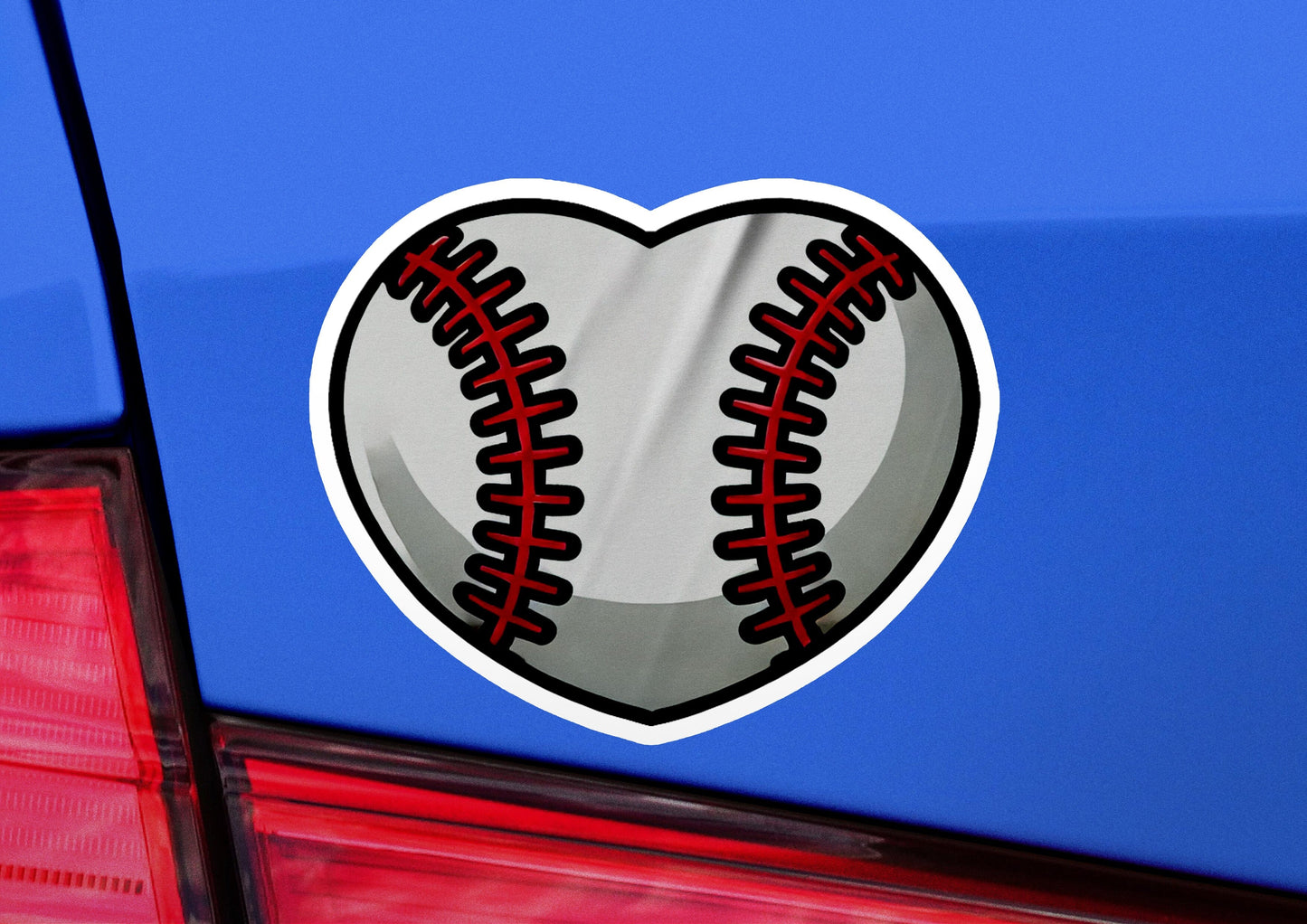 a heart shaped baseball sticker on the back of a car