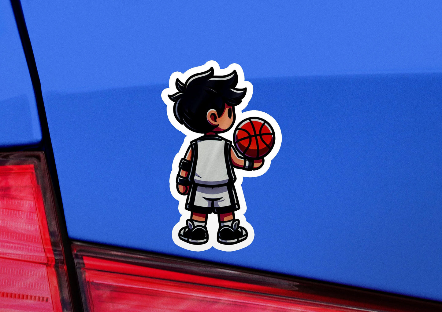 a sticker of a boy holding a basketball
