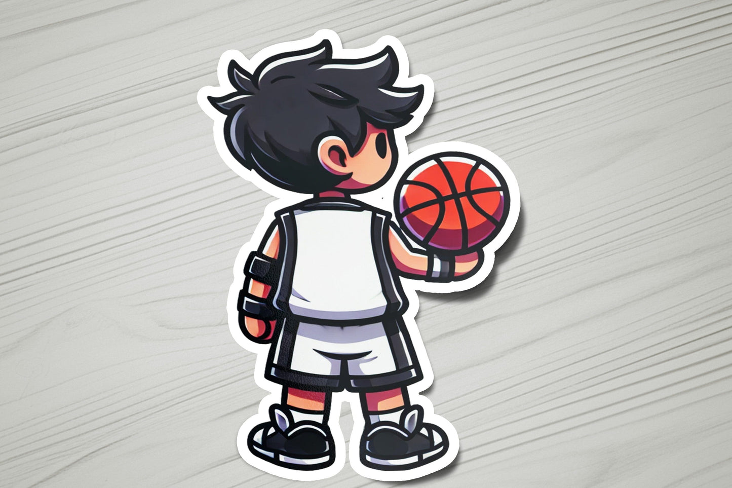 a sticker of a boy holding a basketball