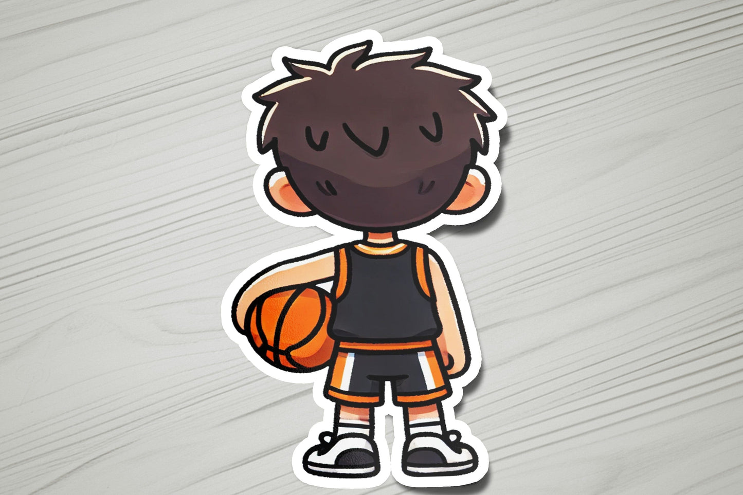 a sticker of a boy holding a basketball