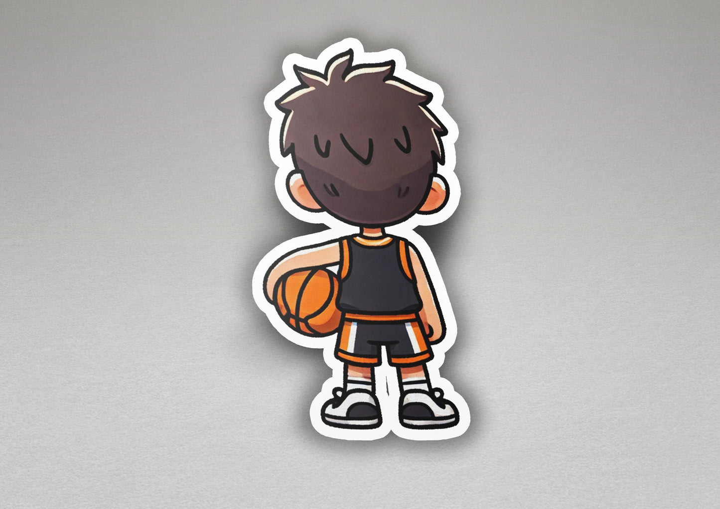 a sticker of a boy holding a basketball