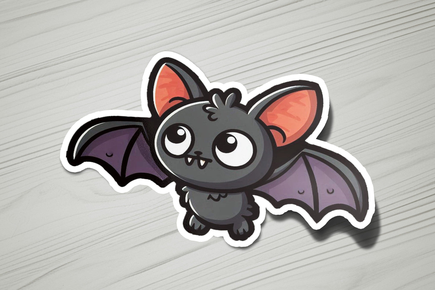 a sticker of a bat on a wooden surface