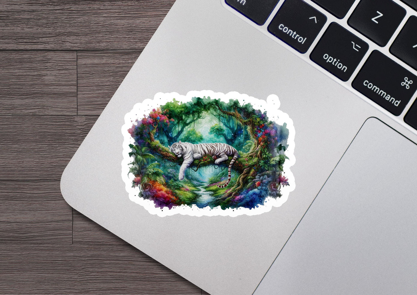 a sticker of a white tiger on a laptop