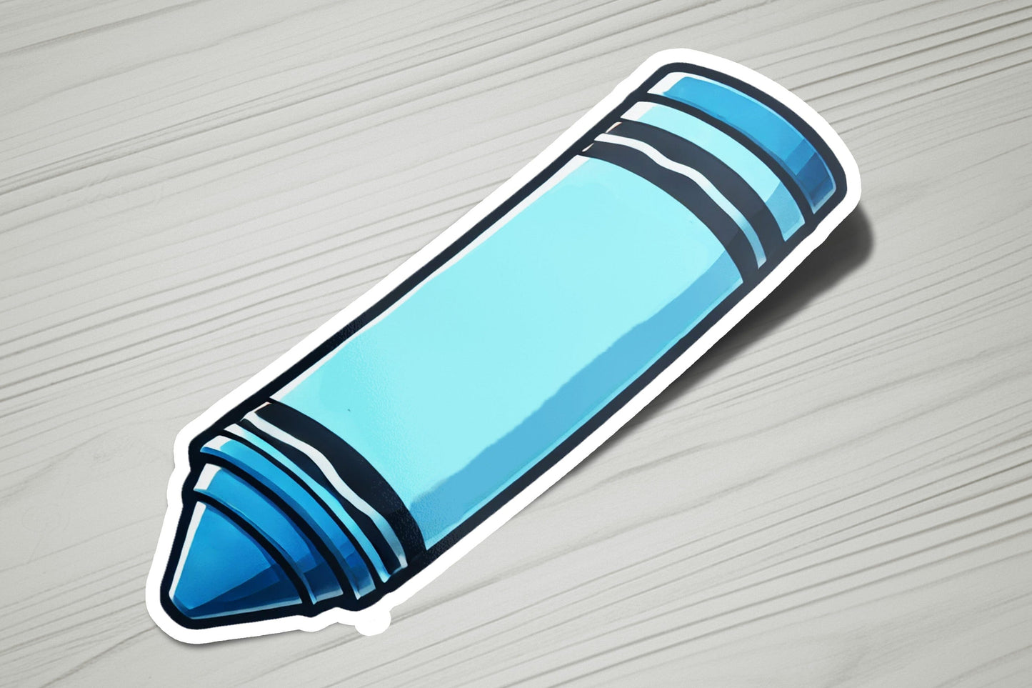a blue crayon sticker sitting on top of a wooden table