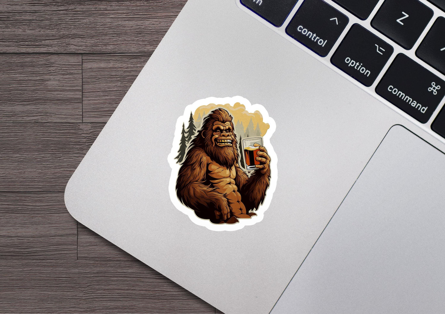 a sticker of a bigfoot holding a glass of beer