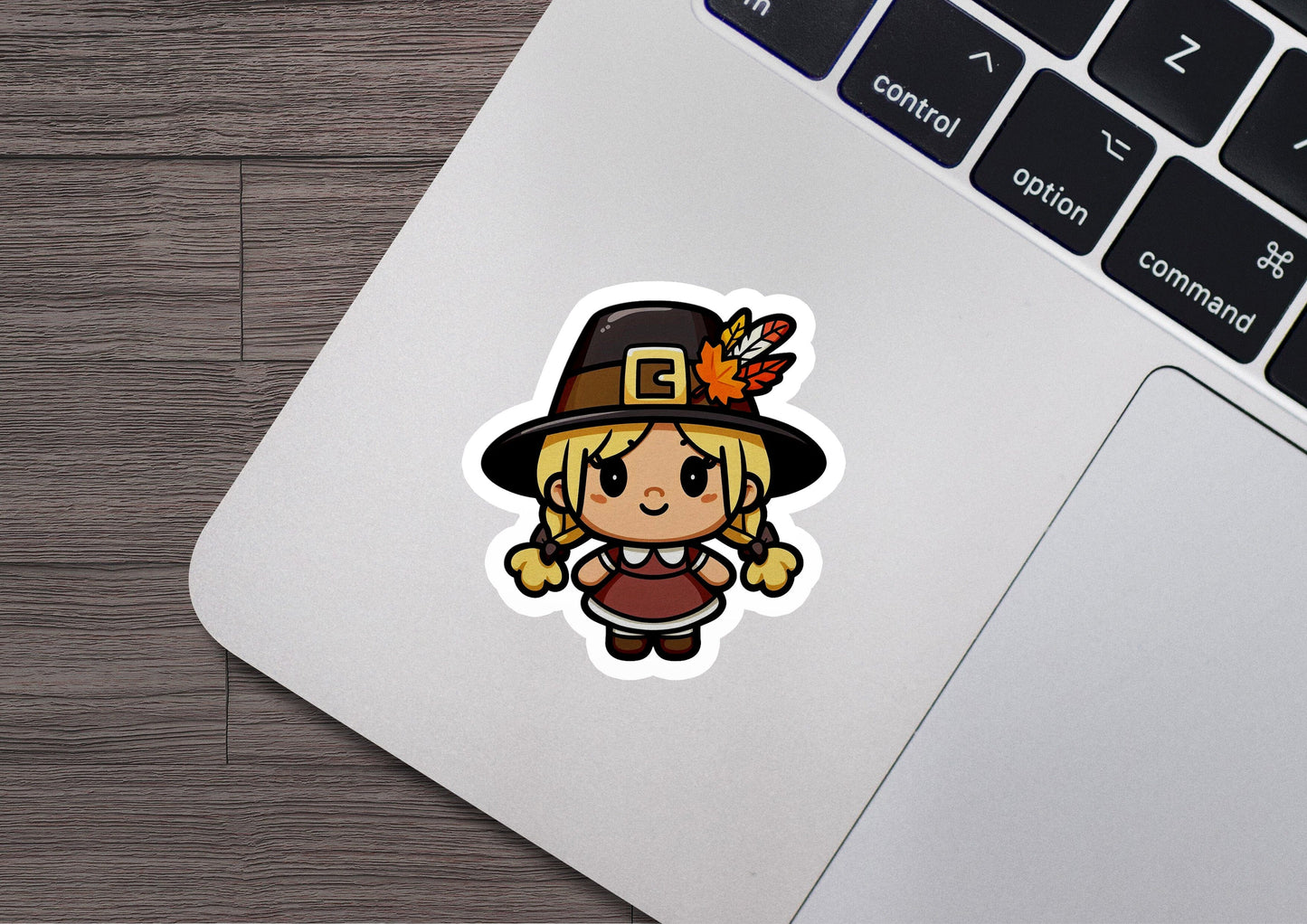 a laptop with a sticker of a girl wearing a hat