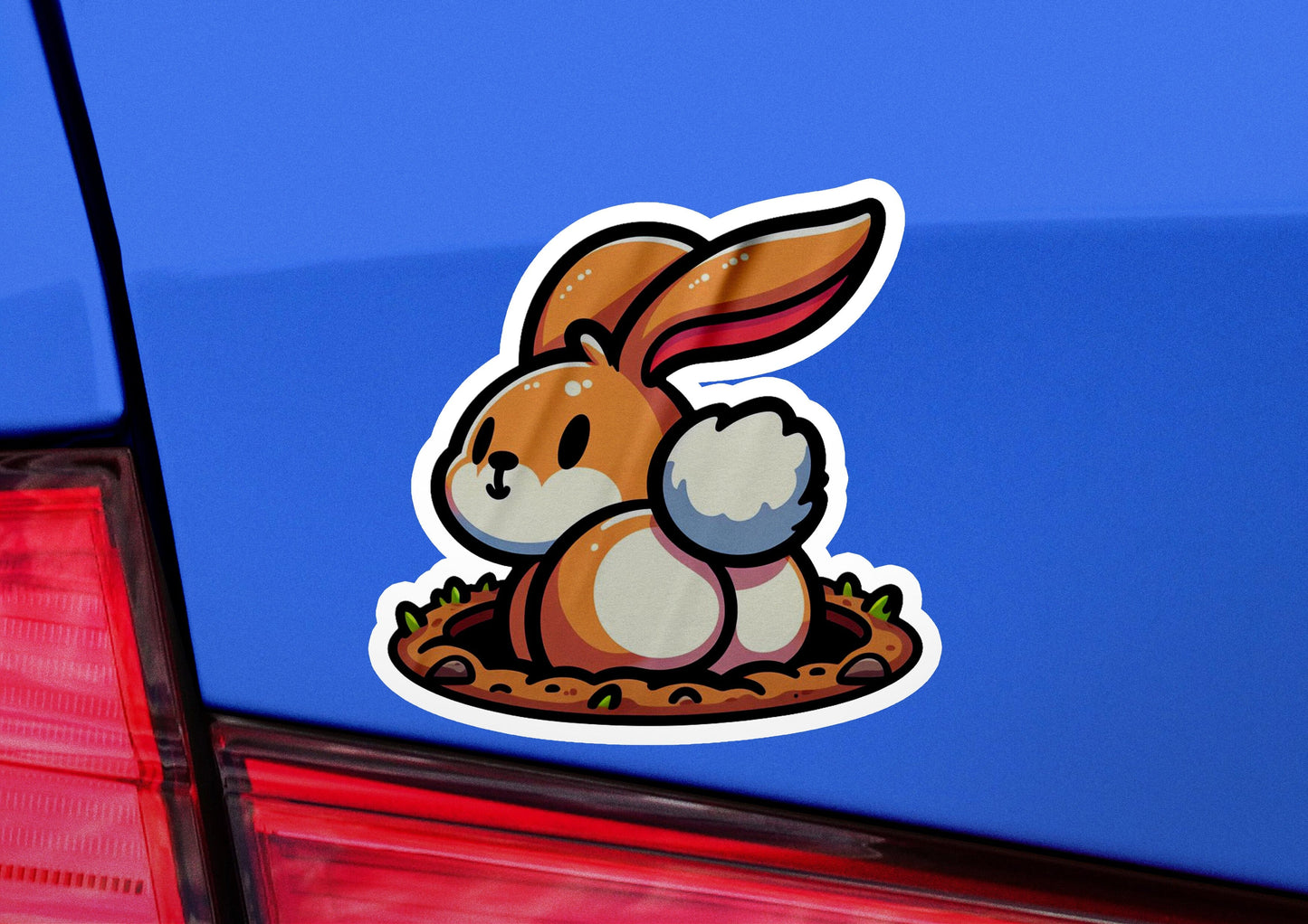 a sticker of a rabbit sitting in a nest