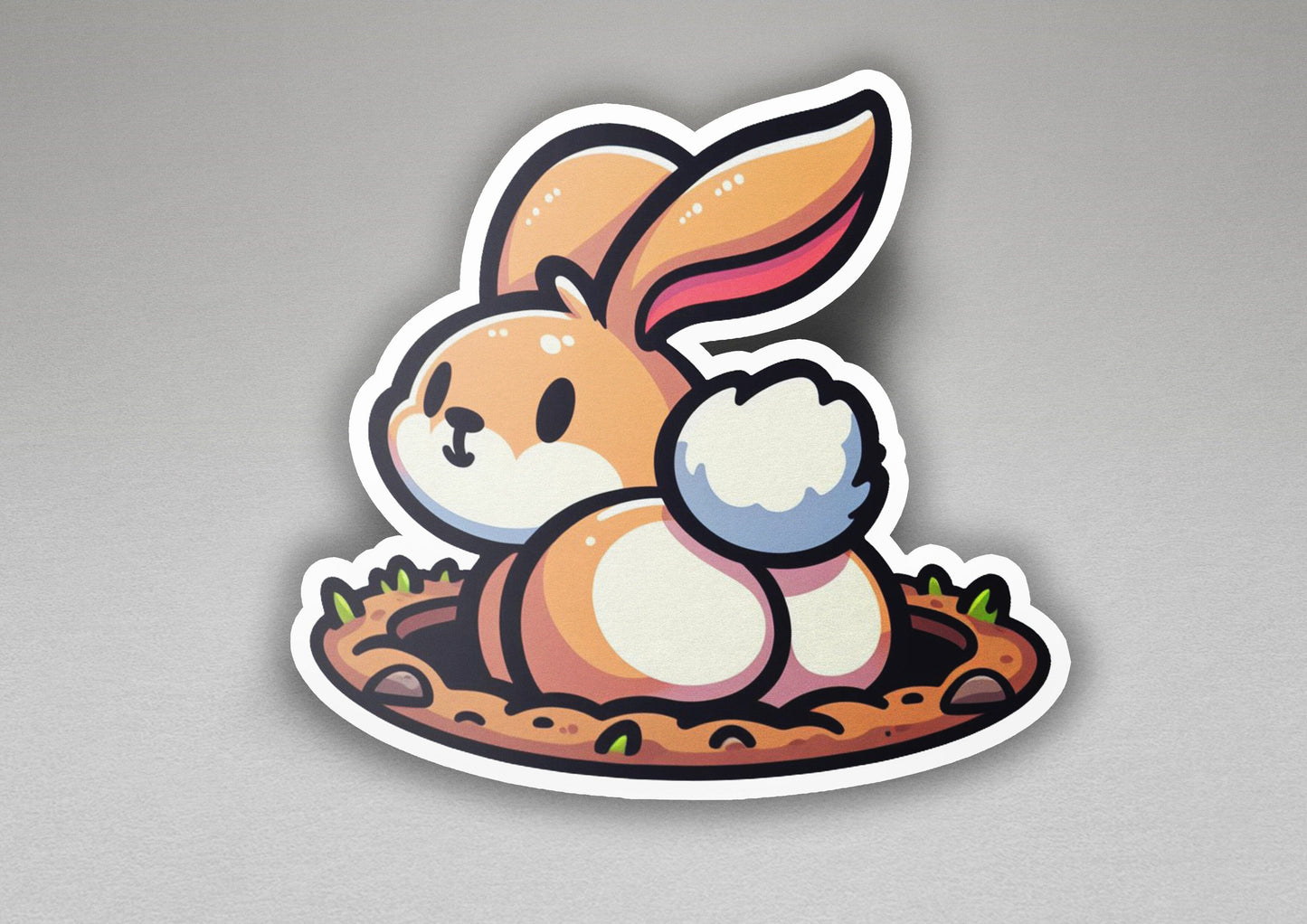 a sticker of a rabbit sitting in a nest