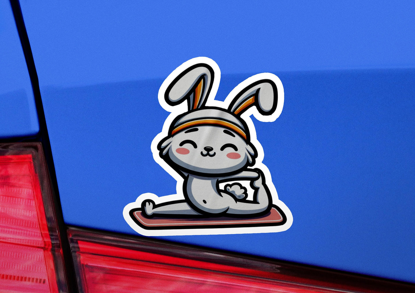 a sticker of a rabbit sitting on a skateboard