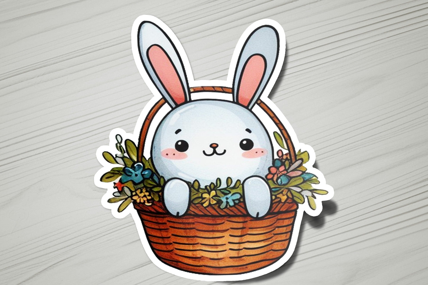 a sticker of a bunny sitting in a basket