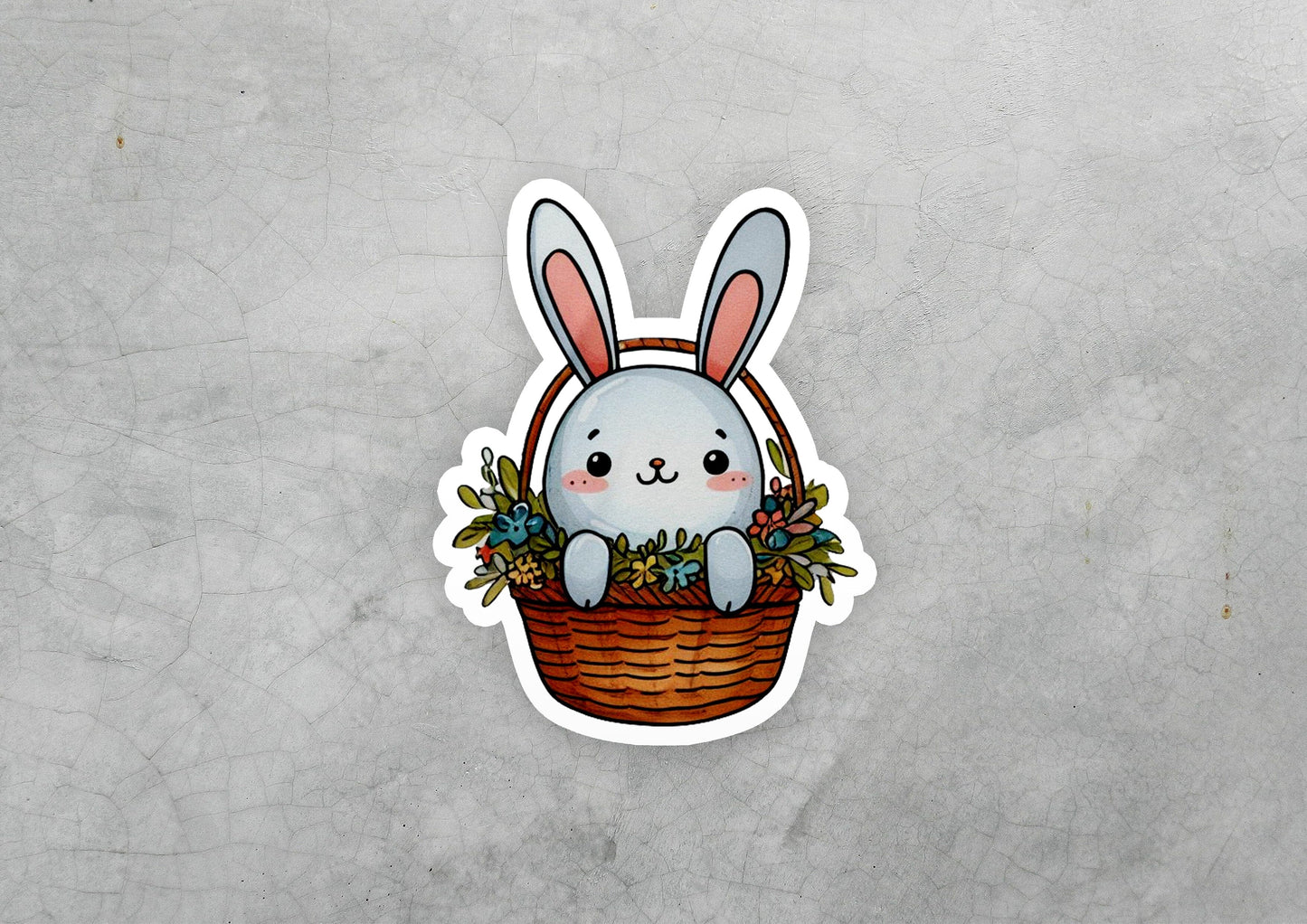 a sticker of a rabbit sitting in a basket