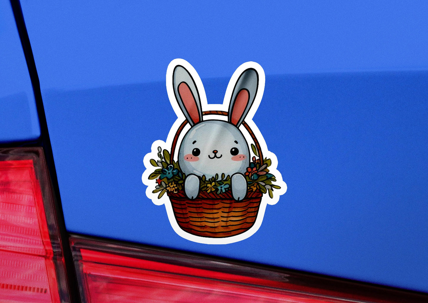 a sticker of a rabbit sitting in a basket