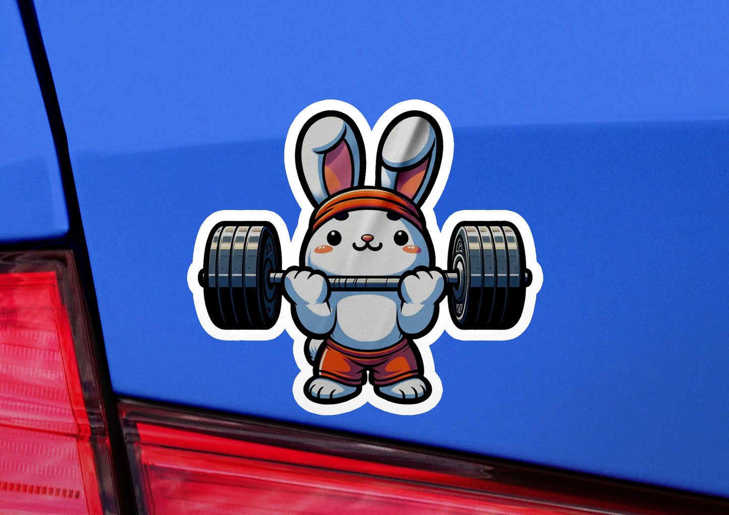 a sticker of a rabbit holding a barbell