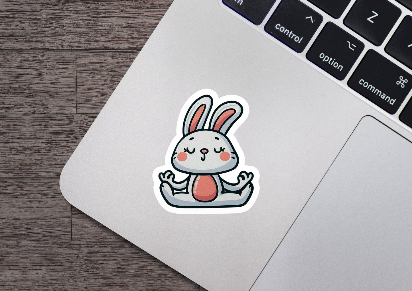 a laptop with a sticker of a rabbit on it