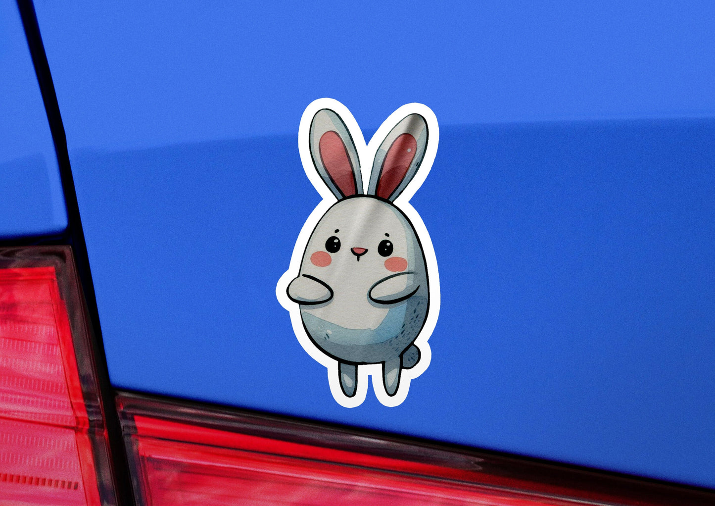 a close up of a car with a sticker of a rabbit