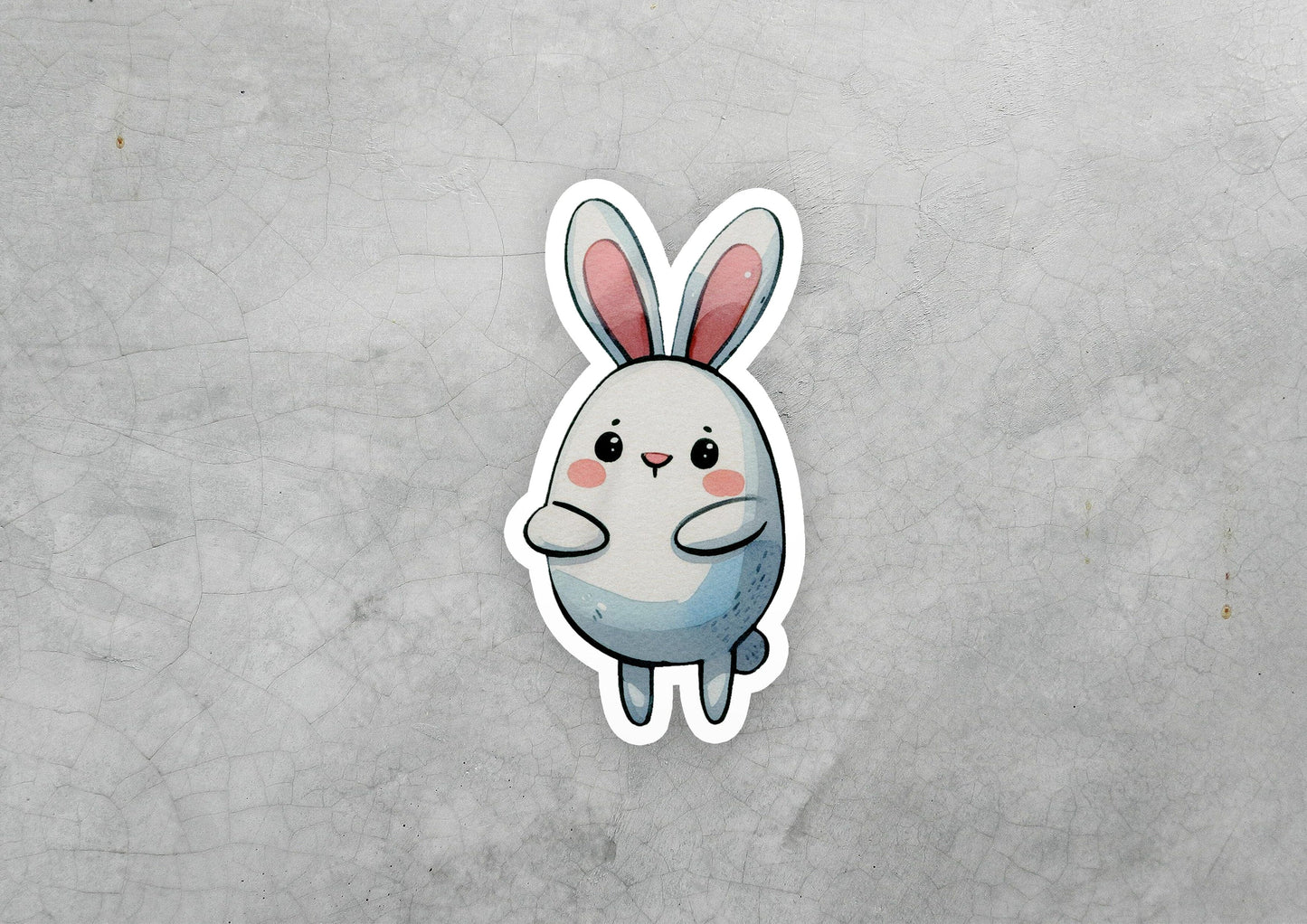 a sticker of a rabbit sitting on top of a table