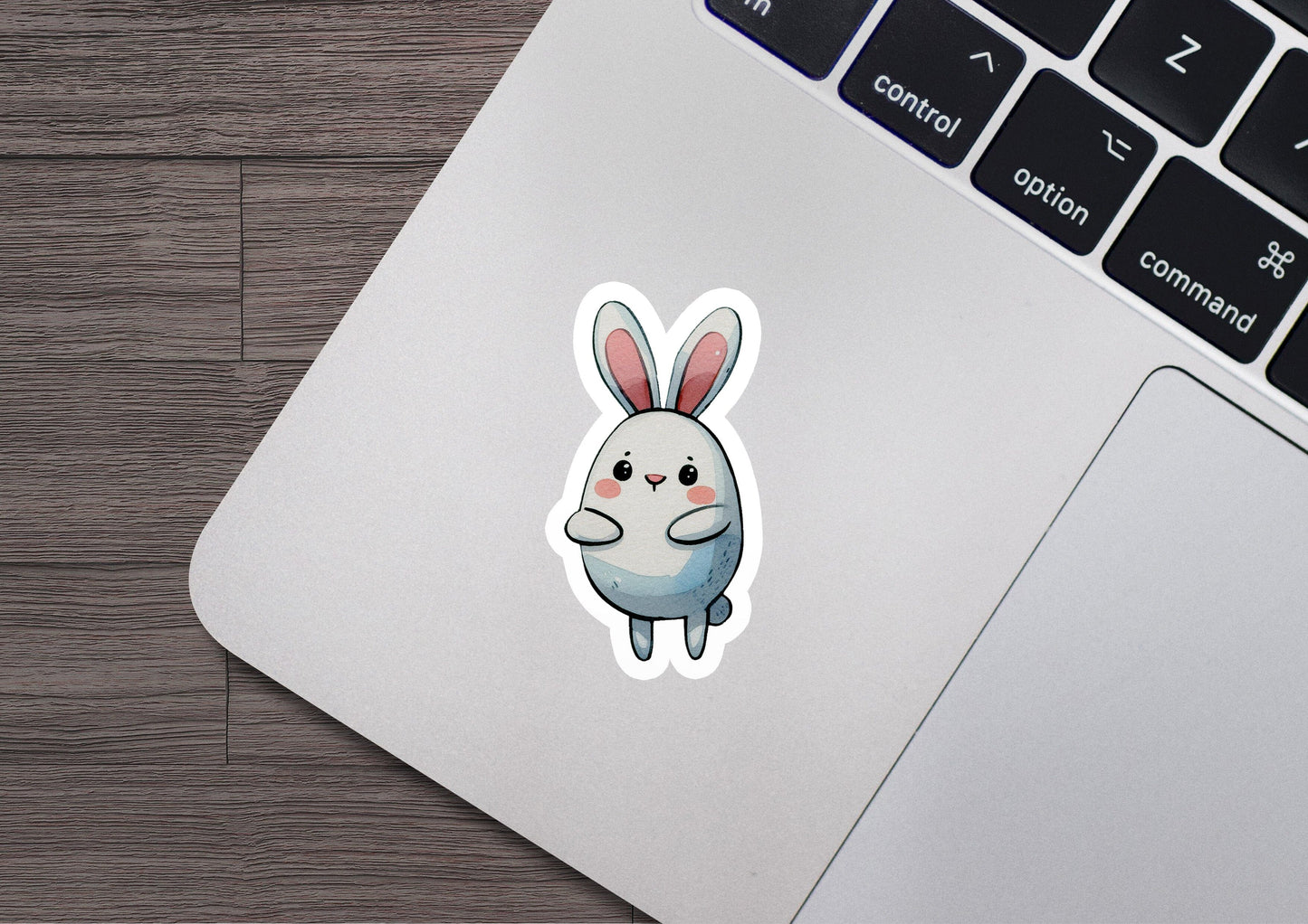 a laptop with a sticker of a rabbit on it